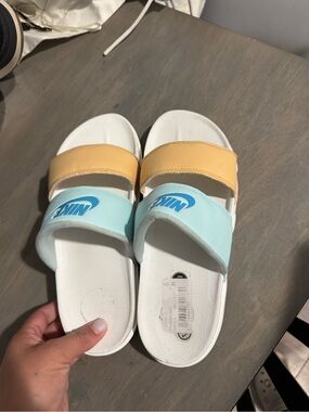 Nike Kids Dual-Strap Slides in Pale Blue and Soft Yellow